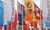 Bunte Fahnen wehen vor dem Messegelände in Berlin. Die Flaggen werben für die Internationale Tourismus Börse (ITB).