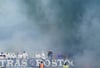 Rostocks-Fans brennen auf der Tribüne Feuerwerkskörper ab.