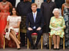 Die britische Königin Elizabeth II., Prinz Harry und seine Frau Meghan auf einer Aufnahme aus dem Sommer 2018.