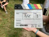 A movie clap is made by professional recordings of film sets, with the room and the microphone.